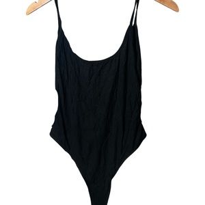 Buckles on crotch area bodysuit